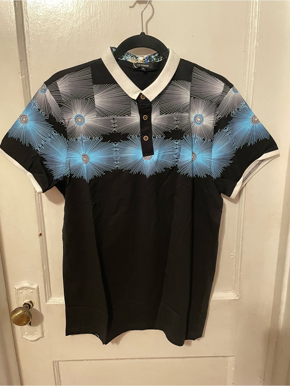Black Polo Shirt with Blue Radial Graphic and Contrast Collar